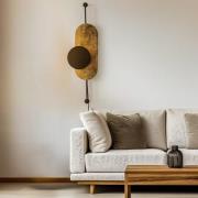Wandlamp Wheel, goud met zwarte afdekking